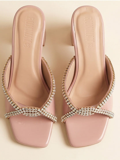 Runway Stores blush pink slide sandals with crystal embellished crisscross straps and a comfortable block heel.