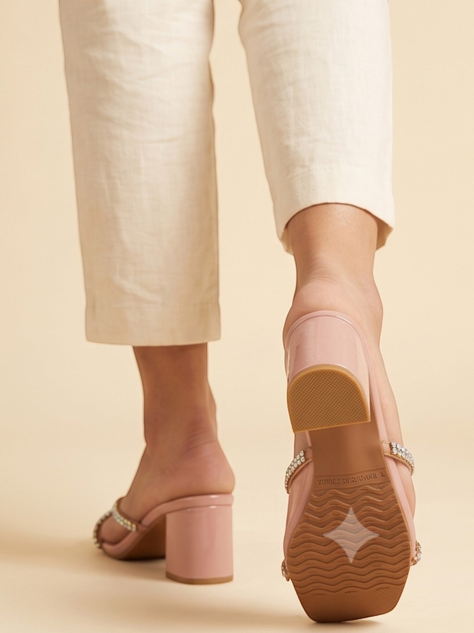 Runway Stores blush pink embellished block heel slide sandals with crystal straps worn with white trousers