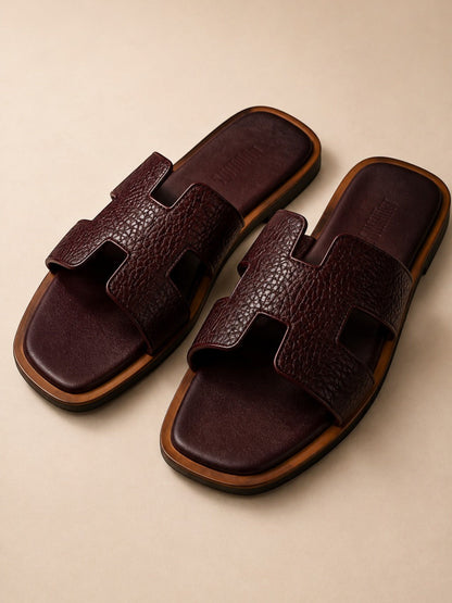 Runway Stores Cyprus burgundy synthetic leather flat sandals with signature H-cut strap and open toe design