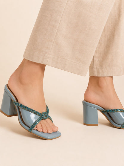 Runway Stores Diana blue block heels with T-shaped open toe and embellished straps worn with beige trousers