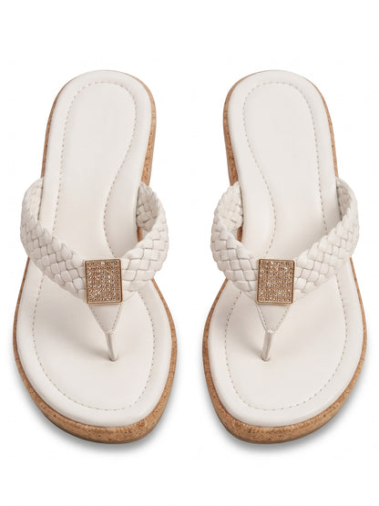 Runway Stores white braided strap thong sandals with a cork wedge heel and a shimmering square embellishment.
